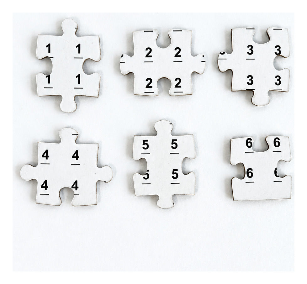 The backs of The Birds’ Christmas Carol puzzle pieces, printed with day numbers 1 through 6